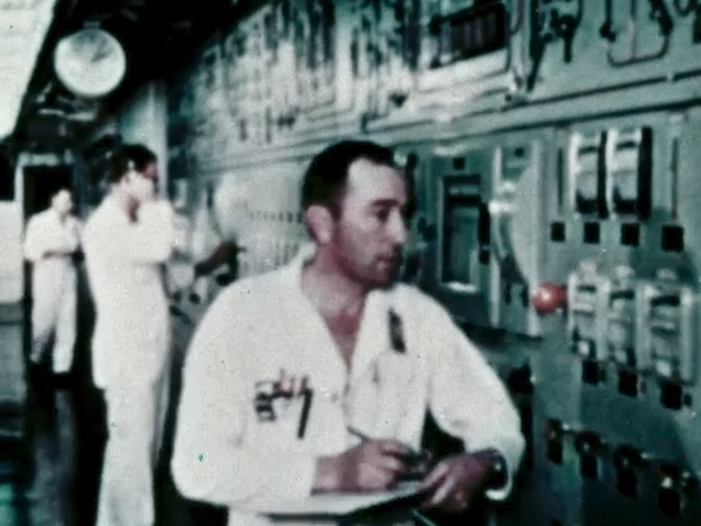 Archival footage of nuclear control room operators