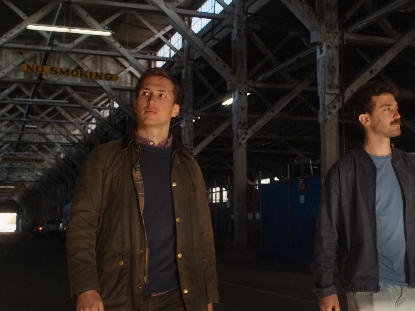Atomarine founders walking through industrial warehouse
